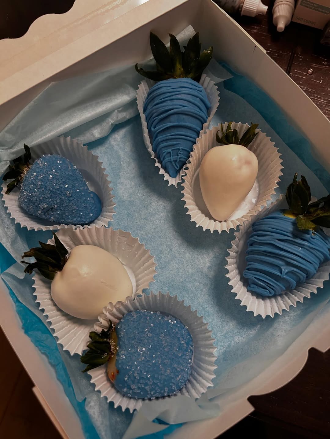 Blue and white chocolate-covered strawberries