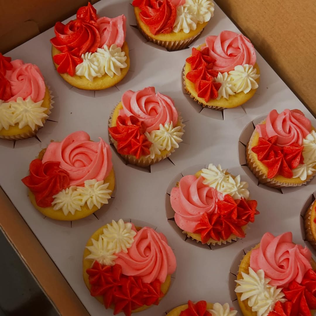 Decorated cupcakes with pink and red buttercream