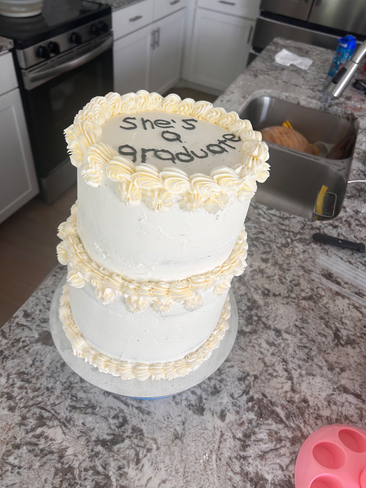 Two-tier celebration cake with piped buttercream