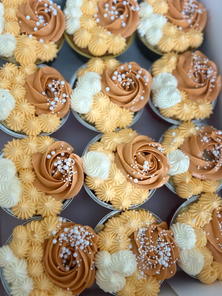 Caramel-toned cupcakes with delicate buttercream piping